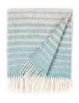 A wool blanket with a striped pattern in shades of light blue and cream, featuring white fringes, made by weaving mill Barker Textiles.