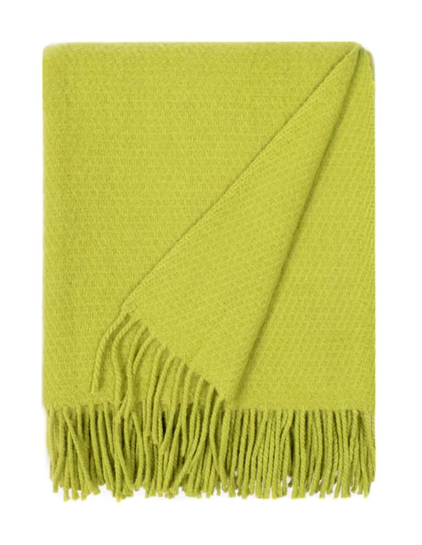 A wool blanket with a solid bright green color and a subtle texture, finished with matching green fringes, made by weaving mill Barker Textiles.