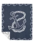 Navy blue blanket featuring a large white anchor design surrounded by a decorative chain border, neatly folded with one corner flipped to reveal the reverse side, made by weaving mill Barker Textiles.