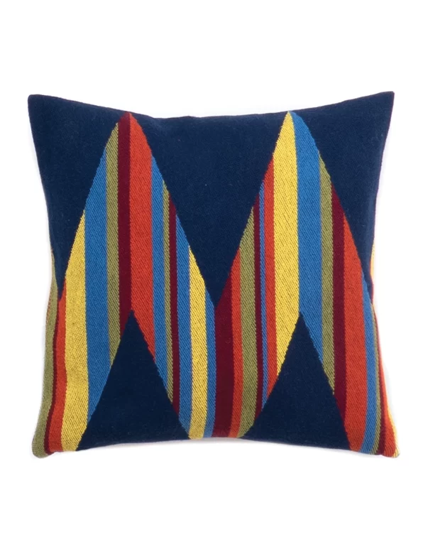 Brightly colored cushion cover with a geometric design featuring stripes in blue, red, yellow, and green made by weaving mill Barker Textiles.