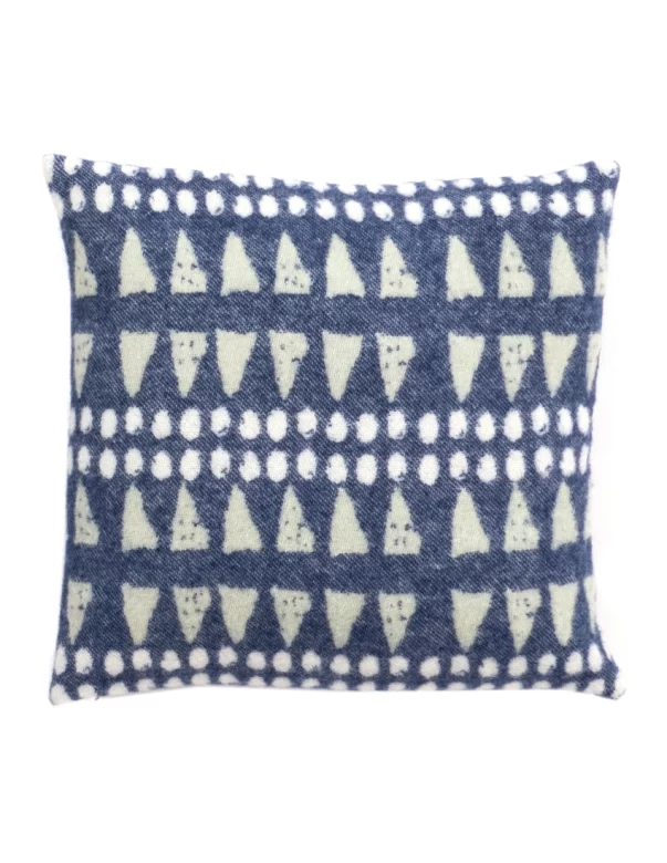 Square cushion cover with a playful pattern of triangles and dots in blue and white, arranged in horizontal rows made by weaving mill Barker Textiles.