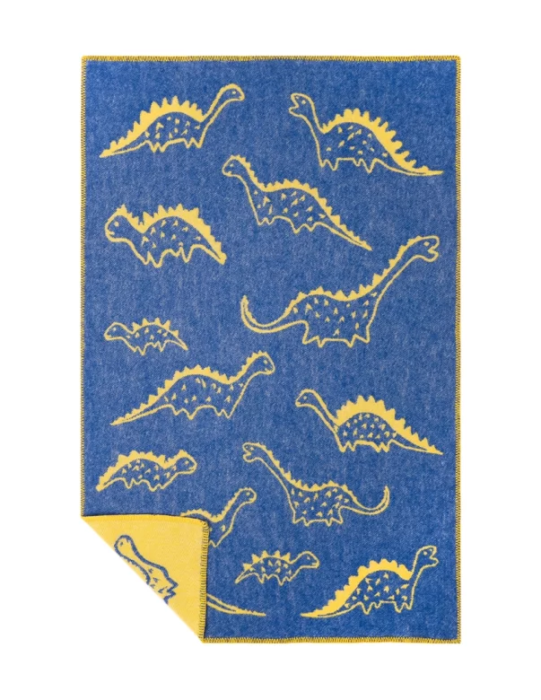 A vibrant blue baby blanket with yellow dinosaurs in different sizes, creating a fun and playful pattern made by weaving mill Barker Textiles.