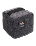 Gray doorstop cube with a black handle and a Barker Textiles label made by weaving mill Barker Textiles.