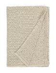 A beige baby blanket with a honeycomb texture, folded to show the reverse side made by weaving mill Barker Textiles.