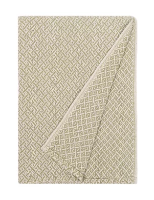 Green blanket with a white diamond pattern, neatly folded with one corner flipped to show the reverse side, made by weaving mill Barker Textiles.