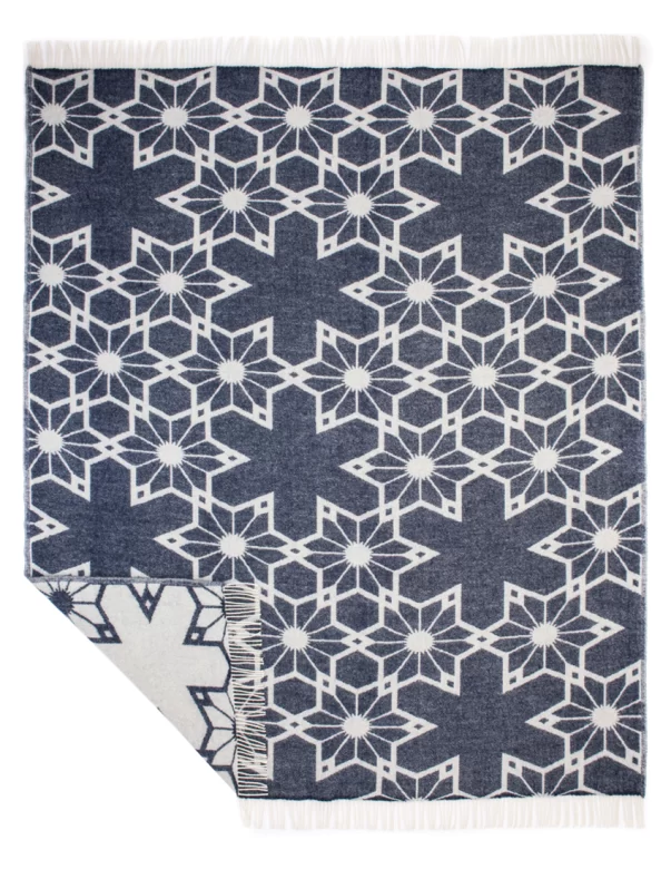 Dark blue wool blanket with a geometric star pattern, crafted by weaving mill Barker Textiles.