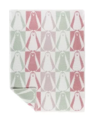 A baby blanket with a checkerboard pattern featuring pastel pink, green, and white penguins made by weaving mill Barker Textiles.