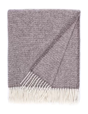 A recycled wool blanket showcasing a geometric pattern in white and gray with fringe edges, crafted by Barker Textiles.