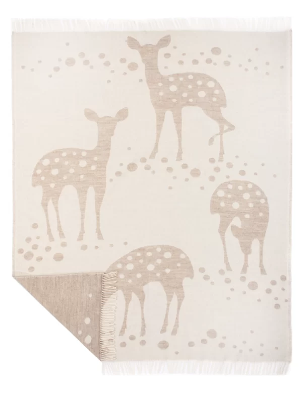 Beige wool blanket featuring a pattern of deer, designed by weaving mill Barker Textiles.