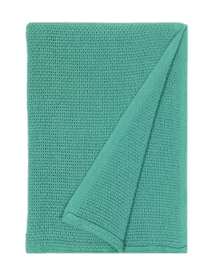 A blanket with a waffle weave pattern in a bright teal color. The texture is prominent, giving a cozy and comfortable feel, made by weaving mill Barker Textiles.