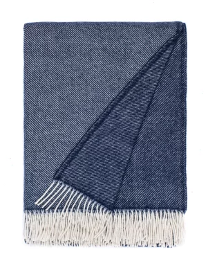 Blue wool blanket with white fringes, made by weaving mill Barker Textiles.